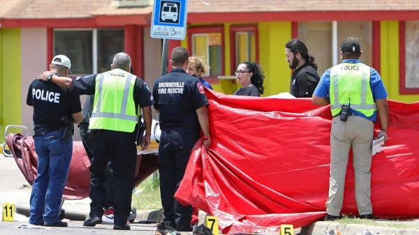 Officers on scene Sunday after a vehicle plowed into a group of people, killing eight