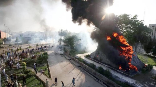 Protesters in Peshawar set fire to the Radio Pakistan premises in protest against the arrest of former Prime Minister Imran Khan. — courtesy EPA