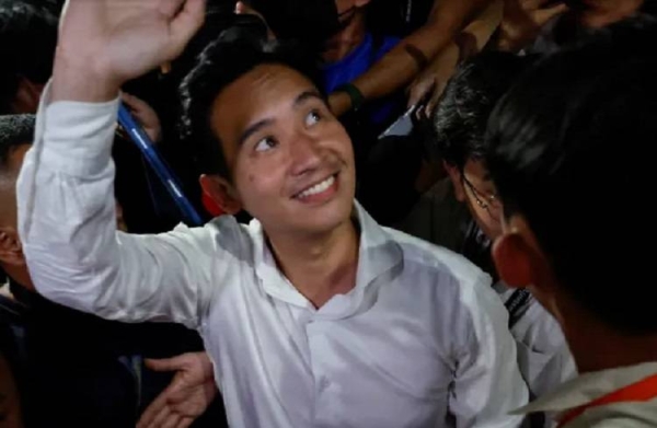 Move Forward Party leader and prime ministerial candidate, Pita Limjaroenrat, waves to the crowd.