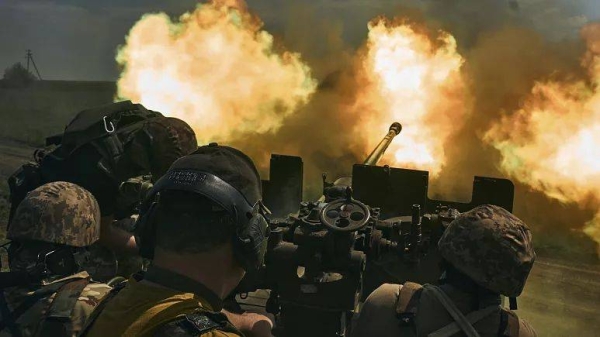 Ukrainian soldiers fire a cannon near Bakhmut, an eastern city where fierce battles against Russian forces have been taking place, in the Donetsk region