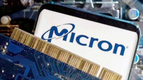 A smartphone with a Micron logo on a computer motherboard. — courtesy Reuters