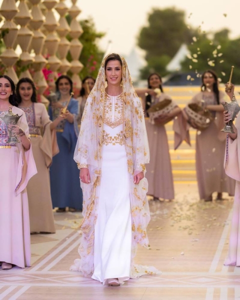Rajwa Al-Saif looked stunning, wearing a gold and white gown designed by Saudi designer Honayda Serafi.