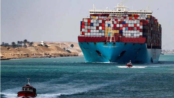 A shipping container passes through the Suez Canal in Suez, Egypt