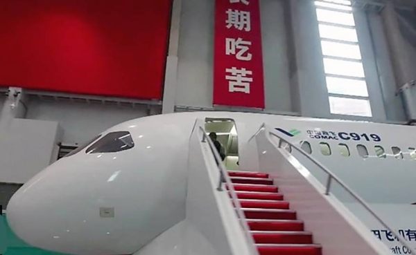 The C919 plane makes the first commercial flight from Shanghai to Beijing.