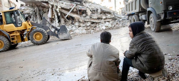 Two children look at damage caused by the February 2023 earthquake tin northwestern Syria. — courtesy UNICEF/Hasan Belal