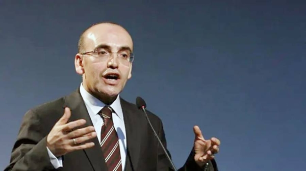 Former economy chief and internationally respected ex-banker Mehmet Simsek has been named as treasury and finance minister in Turkey's new Cabinet.