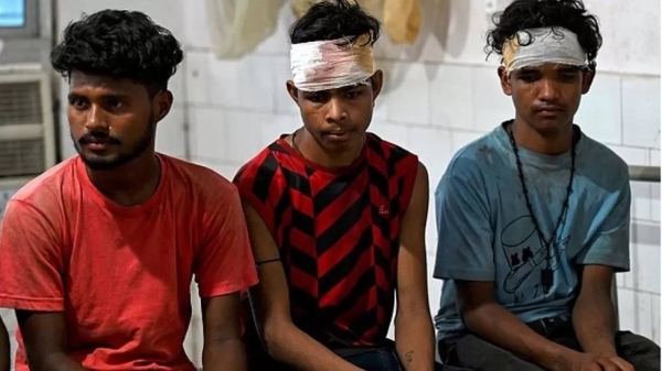 Wounded survivors rescued from a carriage wreckage of a three-train collision near Balasore, sit at the Soro government hospital in Odisha.
