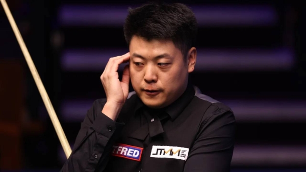 Chinese snooker player Liang Wenbo during a match with Neil Robertson of Australia at the Crucible Theater on April 18, 2021, in Sheffield, England.