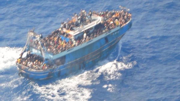 An aerial shot of the fishing vessel carrying migrantsImage source, Greek Coast Guard
