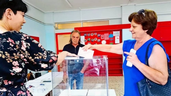 A woman casts her vote during the general elections, at a polling station in Nafplio, Greece, Sunday. — courtesy EPA