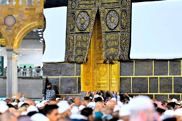 Pilgrims perform Tawaf Al-Ifadah, the obligatory Tawaf of Hajj.