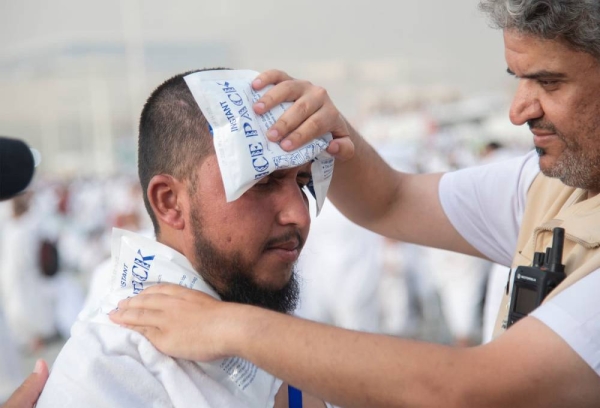 Hajj pilgrim being treated for heat exhaustion on Arafat Day in Hajj 2023