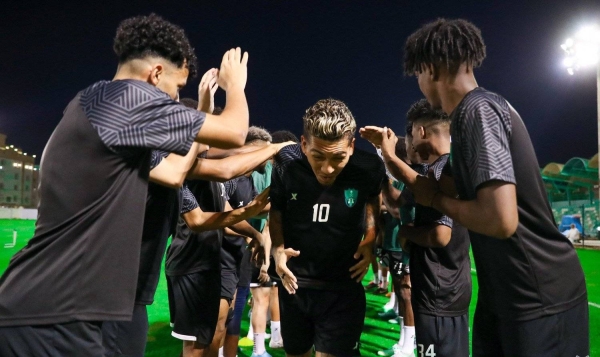 Al-Ahli players welcome the Brazilian star striker Roberto Firmino during their training session in Jeddah.

