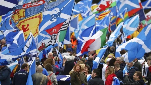 Scottish independence supporters march through Edinburgh, Scotland, Saturday Oct. 5, 2019.