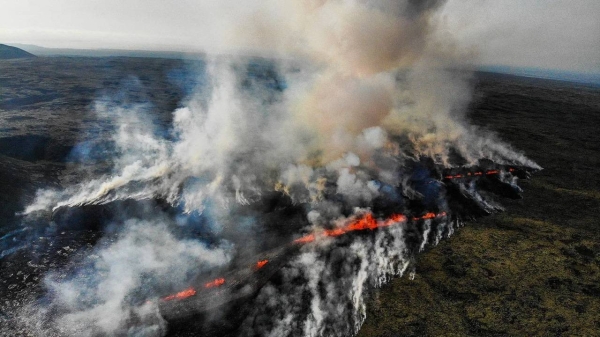 A volcanic eruption emits smoke and flowing lava south of Reykjavik, Iceland on July 10, 2023.