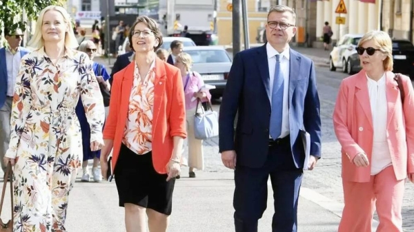 Riikka Purra (left) has joined the prime minister (second right) and two other coalition party leaders in signing a statement on zero tolerance of racism. — courtesy Kimmo Penttinen