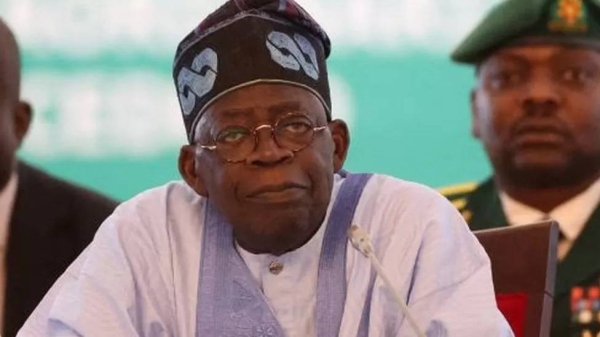 Chairperson of Economic Community of West African States (ECOWAS) and President of Nigeria, Bola Ahmed Tinubu, reacts while addressing the ECOWAS head of states and government in Abuja on July 30, 2023.