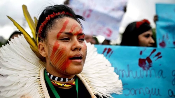 
Indigenous people of different ethnic groups participate in a march for land demarcation, and against violence on indigenous lands and agribusiness, one day before the summit of the Amazon countries, in Belem, Para, Brazil. — courtesy EPA