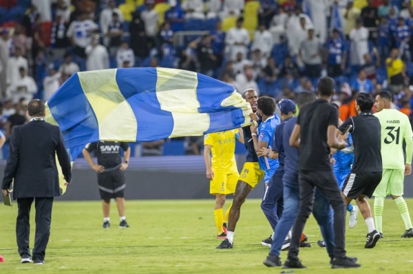 A mass brawl breaks out after Talisca attempted to plant Al-Nassr flag in the pitch following his club’s win over Al-Hilal in the Arab Champions Cup final in Taif on Saturday. (Picture by @Ahmed_bin_nashi)