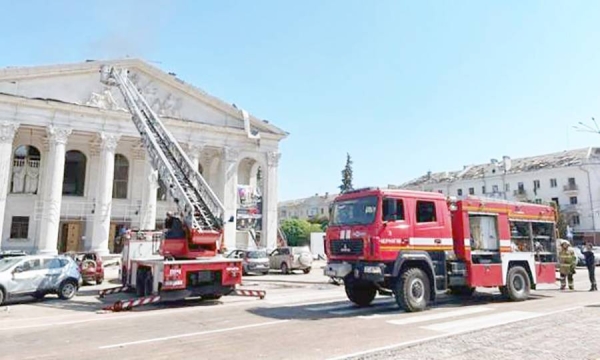 Rescuers work at a site of a Russian missile strike. One of the buildings to be hit by this morning’s strikes in Chernihiv was the city’s theater.