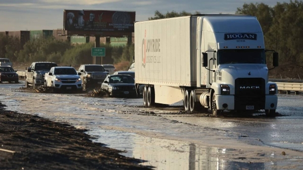 Traffic is slowed as water and mud from Tropical Storm Hilary covers part of Interstate 10, between Indio and Palm Springs, California, on Monday.