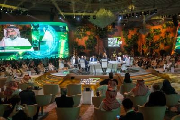 A plenary session at FII6