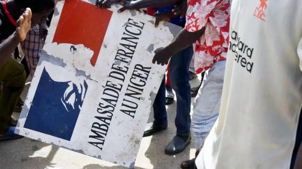 In the wake of July’s coup in Niger, protesters tore down the sign of France’s embassy in the capital, Niamey. — courtesy AFP