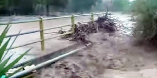 A bridge is submerged during a storm in Greece on Tuesday.