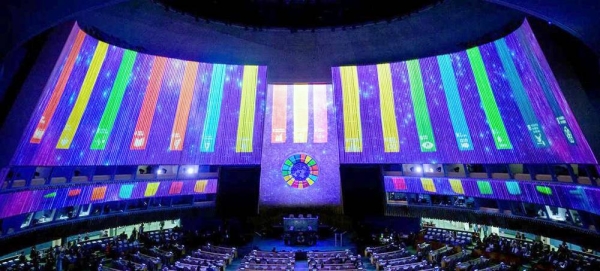 SDG logos are projected in the UN General Assembly Hall in 2022. — courtesy UN Photo/Manuel Elías