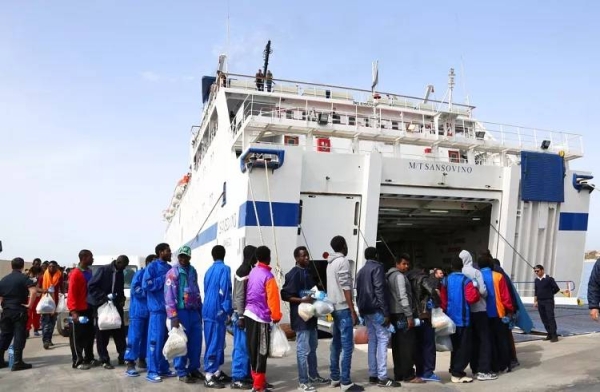 Migrants board on a ferry as they leave the Island of Lampedusa, Southern Italy, to be transferred in Porto Empedocle, Sicily, Friday, April 17, 2015.