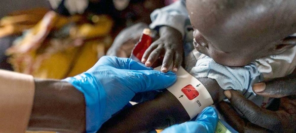 A child is assessed for malnutrition at a health facility in Um Sagour camp in Sudan's White Nile State. — courtesy UNHCR/Ala Kheir