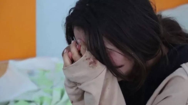 A girl in tears in hospital in Nagorno-Karabakh. Women and children are among the 27 dead and 200 wounded in Karabakh, local authorities say