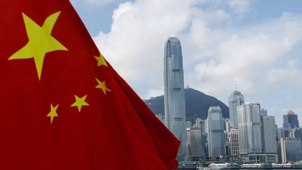 The Chinese national flag is seen in front of the financial district Central in Hong Kong.