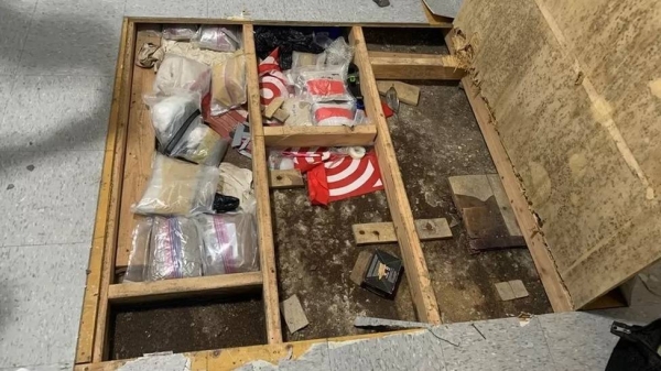 Photos released by New York City Police Department show more than a dozen plastic bags filled with brown and white powders.