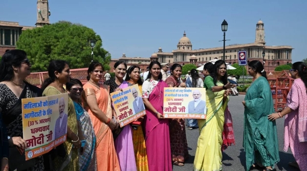 Members of the BJP women's offer sweets in celebration after the Women's Reservation Bill was passed in the Lok Sabha during the Special session of Parliament, in New Delhi, India on Thursday, September 21, 2023.