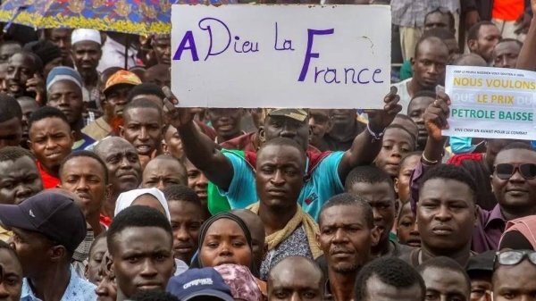 A protester holds a sign saying ‘goodbye France’ at a rally in Niamey last month. — courtesy Reuters