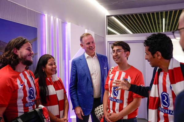 CEO of Riyadh Air Tony Douglas with Atletico Madrid fans.
