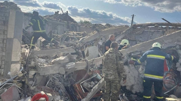 Rescuers work at a site of a Russian military strike in the village of Hroza, in Kharkiv region, Ukraine, on October 5.