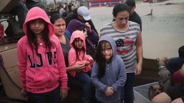 People rescued from a flooded neighborhood after it was inundated with rain water, remnants of Hurricane Harvey, on August 28, 2017 in Houston, Texas