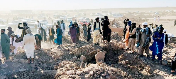 Rescuers in Afghanistan look over a destroyed village following the earthquake. — courtesy WFP