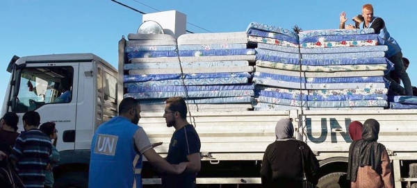 Mattresses are delivered by a UN truck in the south of Gaza. — courtesy UNRWA