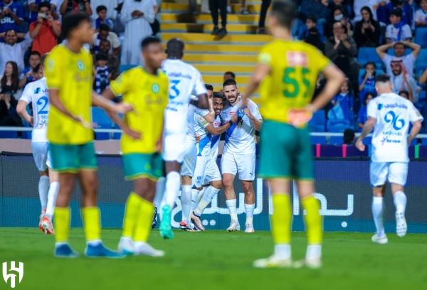 Aleksandar Mitrović celebrates with his teammates. 
