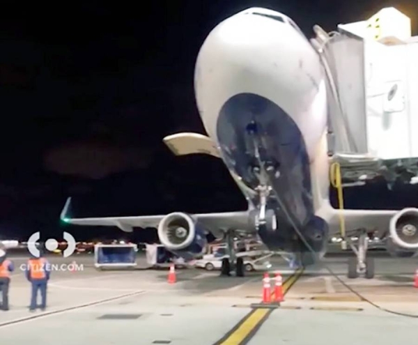 A screengrab from witness video footage of a JetBlue plane that tipped backward causing the nose of the aircraft to lift up at JFK Sunday.