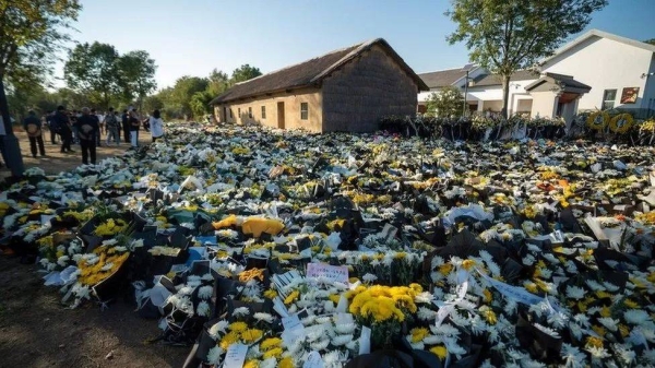 Flowers left by mourners in Jiuzi, Li's ancestral village