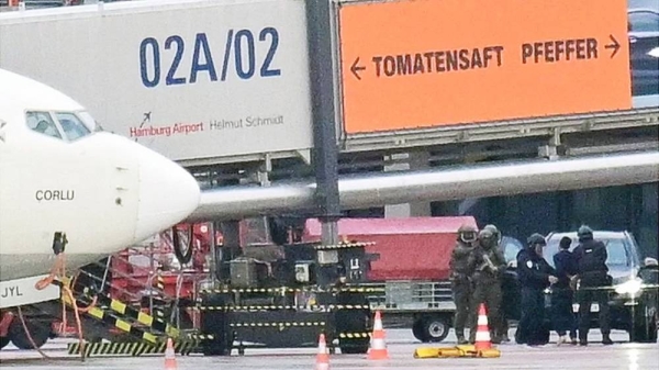 Special forces detain a suspect after a man drove through a barrier on to the grounds of the city’s airport with a child in his car in Hamburg, Germany, Sunday. — courtesy Reuters