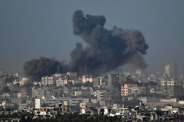 TOPSHOT - This picture taken near the Israeli border with the Gaza Strip on November 7, 2023, shows smoke rising from Gaza after Israeli strikes, amid ongoing battles between Israel and the Palestinian Hamas movement. (Photo by Aris MESSINIS / AFP) (Photo by ARIS MESSINIS/AFP via Getty Images)