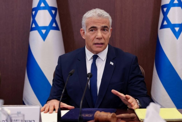 Israel's outgoing Prime Minister Yair Lapid heads a cabinet meeting in Jerusalem, on November 20, 2022. Menahem Kahana/Pool via REUTERS