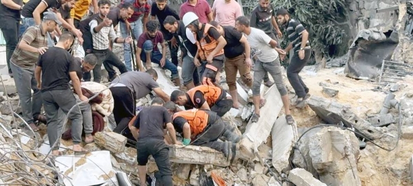 Palestinian Civil Defense responders search the rubble of a building in the aftermath of an air strike in the Gaza Strip. (file). — courtesy WHO