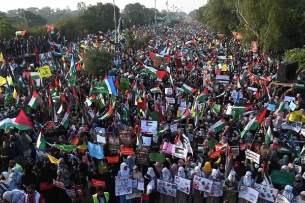 Supporters of Jamaat-e-Islami (JI) party take part in a march to express their solidarity with Palestinians in Lahore on Sunday