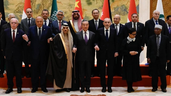China's Foreign Minister Wang Yi with representatives from Muslim-majority nations at the Diaoyutai State Guest House in Beijing on November 20